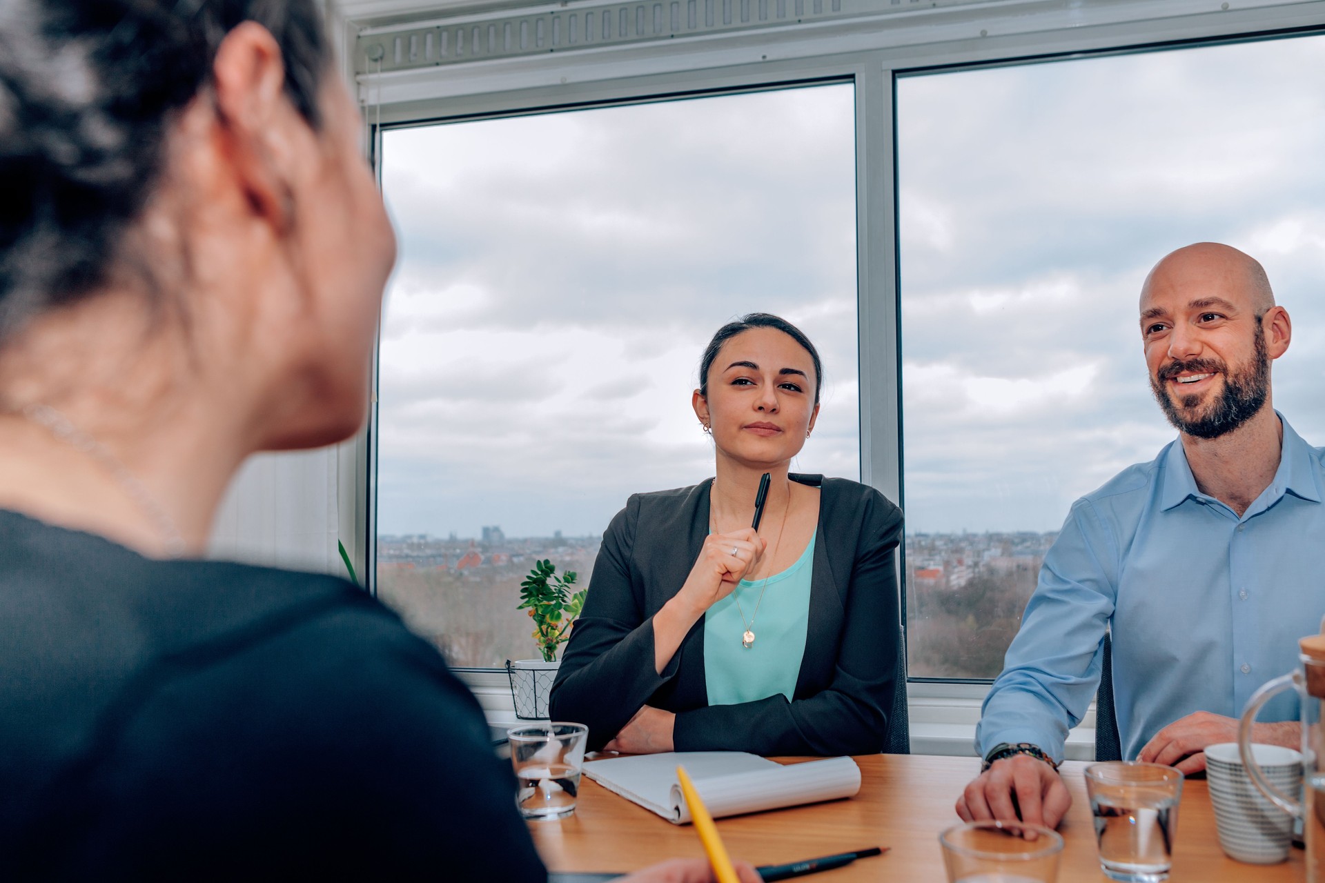 human resource doing an interview to applicant for a job position - businesswoman and businessman sitting at desk